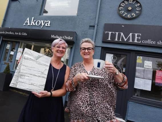 Kathryn Hawkins, left, runs Akoya, a jewellery, art and gift shop, next door to sister Nicola Burns, owner of Time coffee shop, on Preston Road, Standish.