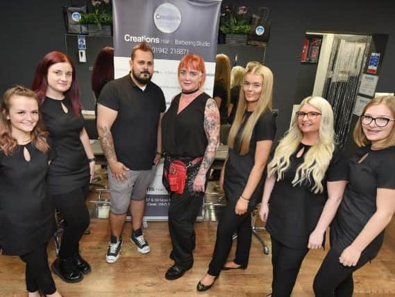 Lorraine Rigby , centre with the team at Creations Hair and Barbering Studio,  from left, Nicole Calland, Alison Burrows, David Sullivan, Lorraine Rigby, Dione Rainford, Charley Evans and Olivia Long.