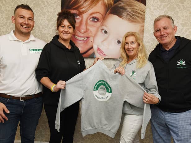 Loui's parents Gavin and Emma Aspinall with his grandparents Anne and Tim Aspinall, next to a photograph of Loui