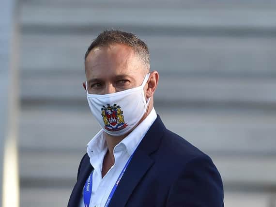 Adrian Lam wearing a Warriors face mask