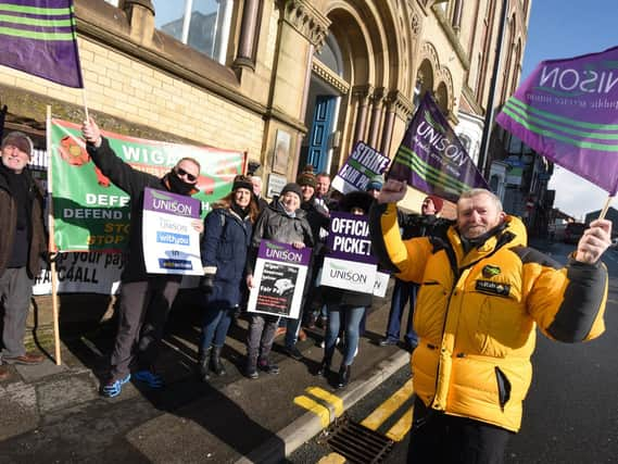 Workers on the picket line earlier in the dispute