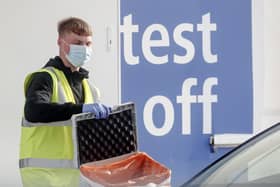 A worker at a Covid-19 test centre. Cases are rising across the country