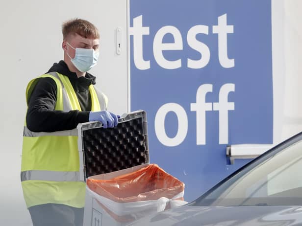 A worker at a Covid-19 test centre. Cases are rising across the country