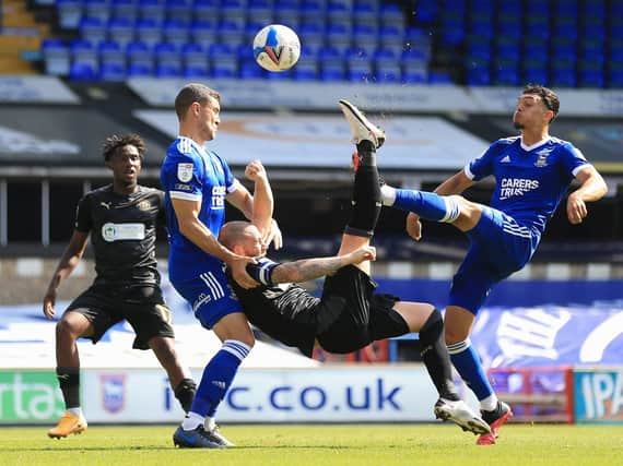 Joe Garner hits the bar with his early bicycle kick