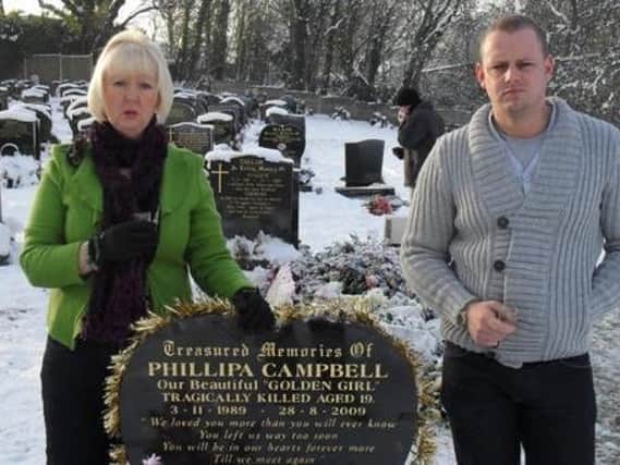 Phillipa Campbell's mum Sue and brother Lee at her grave