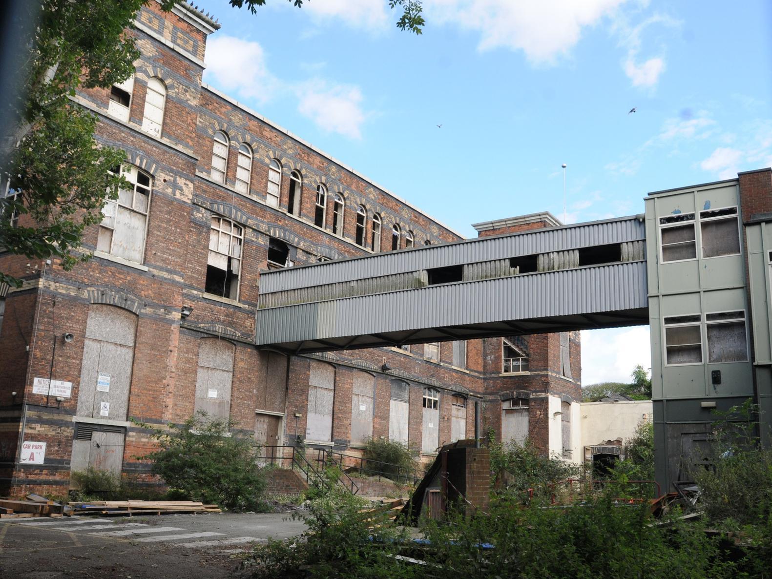 Demolition work begins on dangerous building at historic Wigan mill 