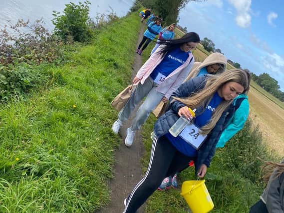 Fund-raisers walk along the canal
