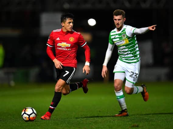 Tom James in action for Yeovil Town against Manchester United