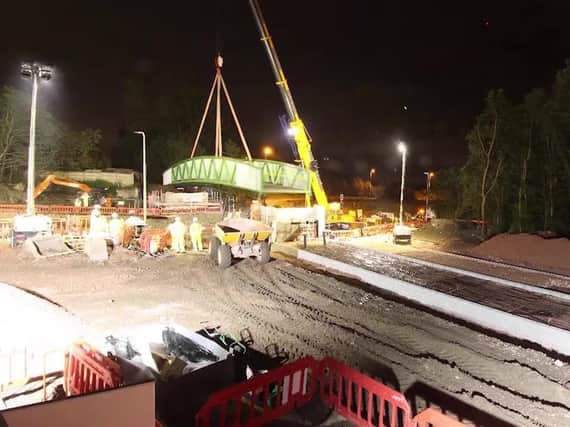 A crane was used to move the bridge