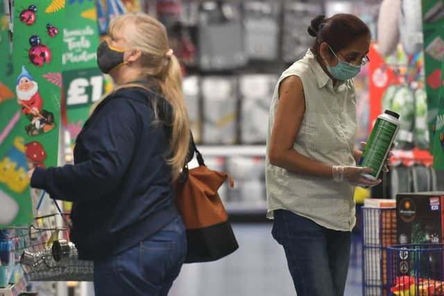 Shoppers wearing face coverings