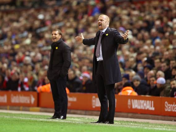 Brendan Rodgers, manager of Liverpool and Manager Sean Dyche of Burnley on the touchline during the Barclays Premier League match between Liverpool and Burnley at Anfield on March 4, 2015 in Liverpool, England. (Photo by Michael Steele/Getty Images)