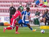 Viv Solomon-Otabor gives the Gillingham defence a tough time