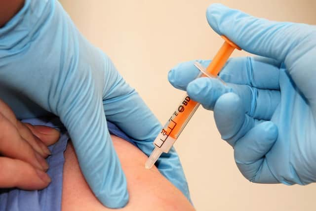 A patient is given a swine flu vaccination