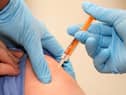 A patient is given a swine flu vaccination