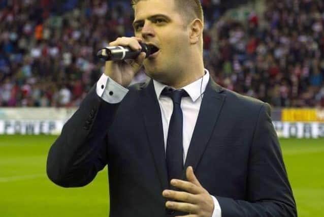 Peter Hill performing at the DW Stadium