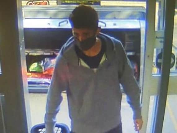 The man police want to speak to in connection with the Orrell Co-op robbery