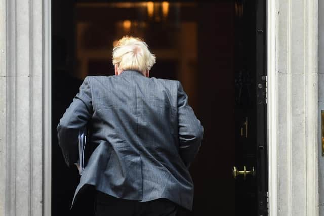 Prime Minister Boris Johnson arrives in Downing Street after giving an update on Coronavirus lockdown measures