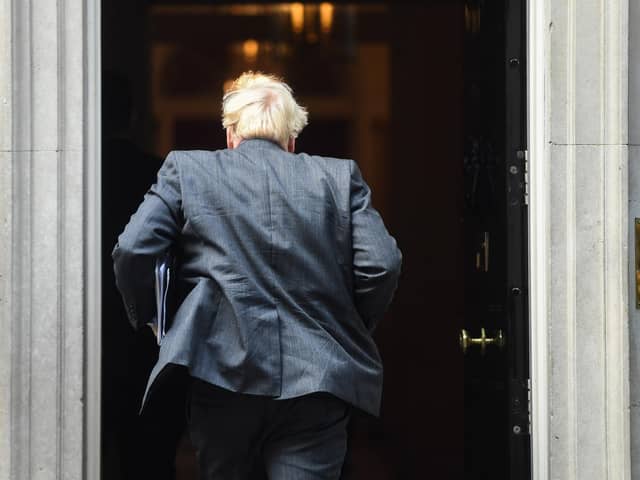 Prime Minister Boris Johnson arrives in Downing Street after giving an update on Coronavirus lockdown measures