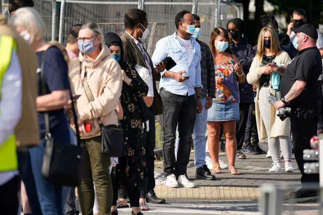 People queue at a walk in Covid-19 testing centre on September 17, 2020 in Bolton