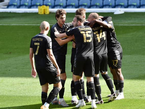 Latics celebrate Lee Evans' opening goal