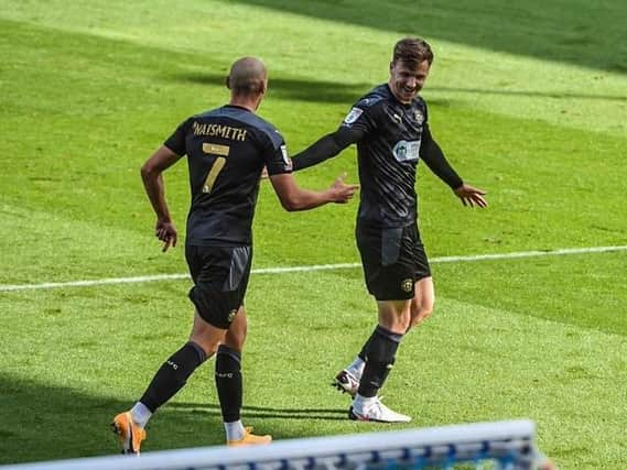 Lee Evans celebrates opening the scoring at Fratton Park