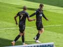 Lee Evans celebrates opening the scoring at Fratton Park
