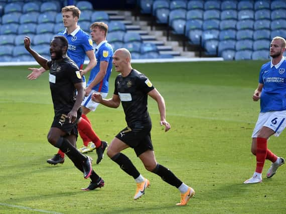 Nathan Cameron and Kal Naismith watch as Tom James' free-kick flies in to make it 2-0