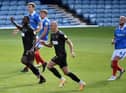 Nathan Cameron and Kal Naismith watch as Tom James' free-kick flies in to make it 2-0
