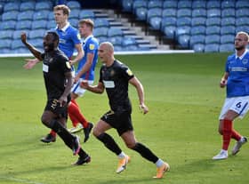 Nathan Cameron and Kal Naismith watch as Tom James' free-kick flies in to make it 2-0