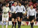 Wayne Rooney tries to get the matchball from the referee after a hat-trick on his debut during the Champions League Group D match between Manchester United and Fenerbahce at Old Trafford on September 28, 2004