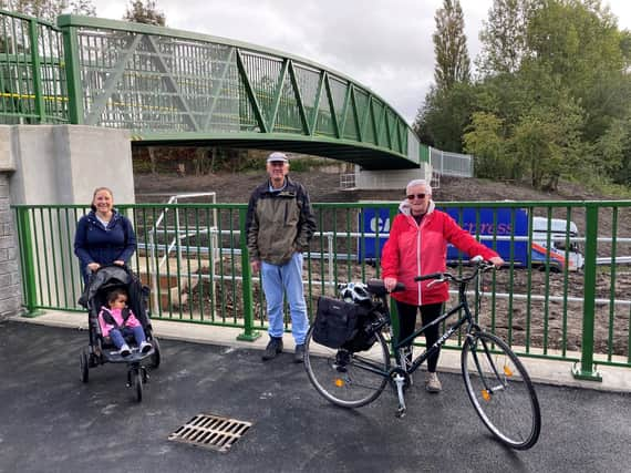 Residents Nic Winstanley, Esmond Howarth and Ann Miller welcome the new bridge