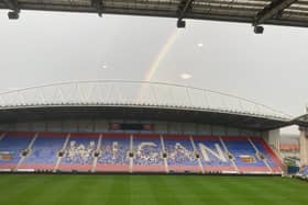 A rainbow sums up the mood at Wigan Athletic on Wednesday evening
