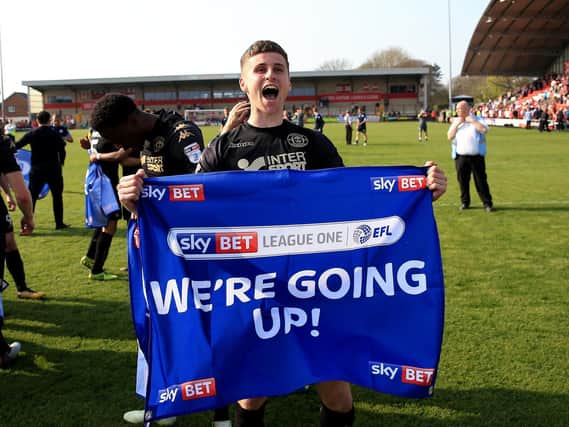 Colclough celebrates Wigan Athletic's promotion to the Championship in 2018