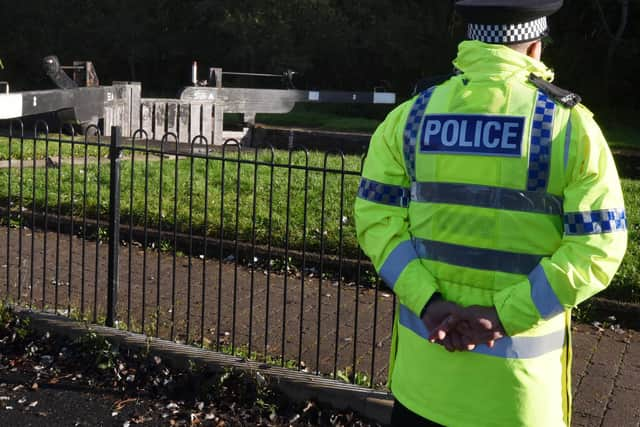 The canal at Poolstock is sealed off as forensic examiners continue their work at the scene