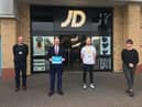 Mr Grundy (second left) during his JD Sports visit