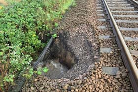 Heavy rain caused part of the embankment supporting the Wigan to Southport line to give way
