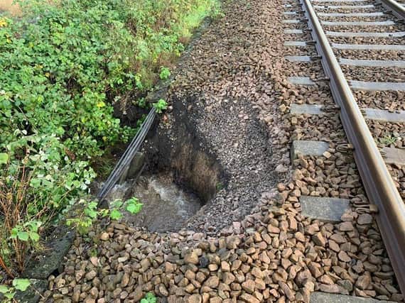 Heavy rain caused part of the embankment supporting the Wigan to Southport line to give way