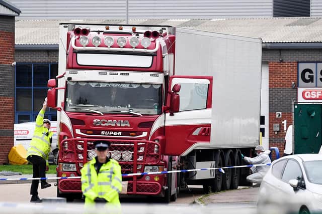 Police and forensic officers investigate a lorry in which 39 bodies were discovered in the trailer, as they prepare move the vehicle from the site on October 23, 2019 in Thurrock (Photo by Leon Neal/Getty Images)
