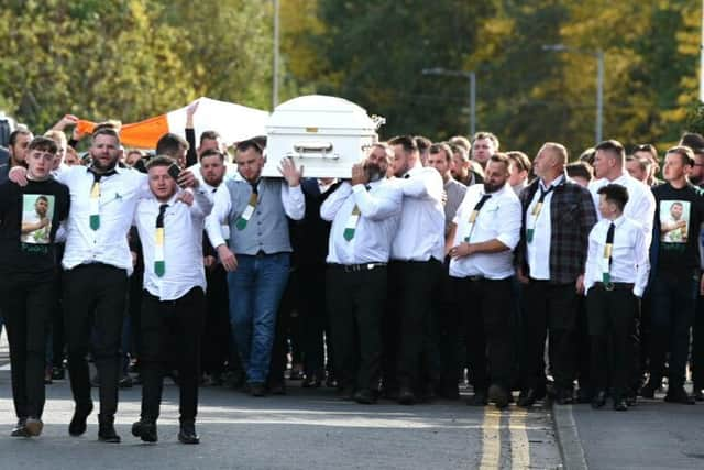 Family and friends carry the coffin of Patrick Connors