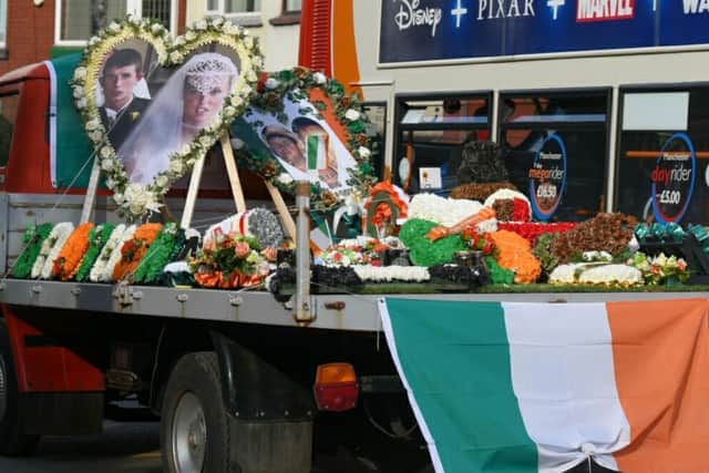Lorries with flowers and photos of Patrick Connors