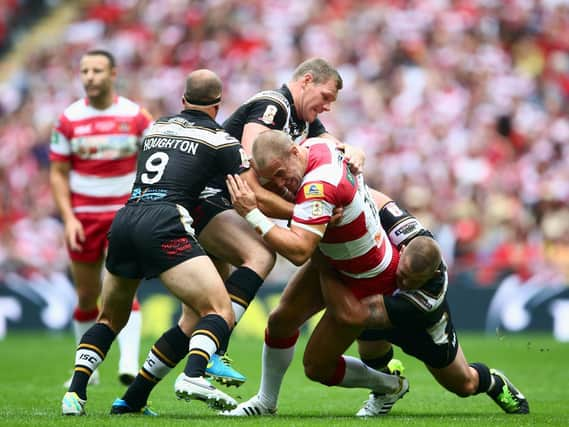 Lee Mossop takes the ball up for Wigan during the 2013 Challenge Cup final