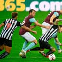 Newcastle United's Irish midfielder Jeff Hendrick is tackled by Burnley's English defender James Tarkowski (back) and Dale Stephens (2nd L) during the English Premier League football match between Newcastle United and Burnley at St James' Park in Newcastle-upon-Tyne, north east England on October 3, 2020. (Photo by PETER POWELL / POOL / AFP)