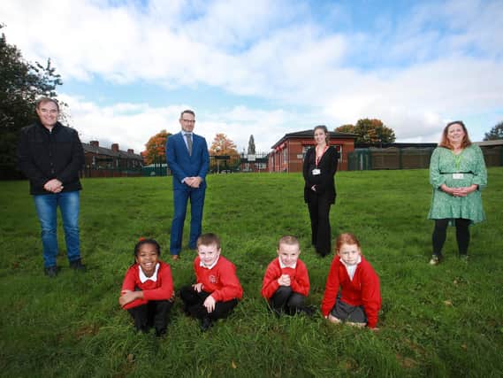 Paul Barton, Allan McGregor, year two teacher Catherine Featherstone, Allison McIntosh and pupils at the site which will be converted into a wildlife area