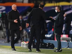 Slaven Bilic, Manager of West Bromwich Albion and Sean Dyche, Manager of Burnley interact with the Fourth Official Kevin Friend at full-time after the Premier League match between West Bromwich Albion and Burnley at The Hawthorns on October 19, 2020 in West Bromwich, England.