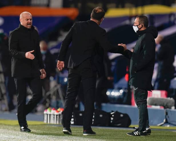 Slaven Bilic, Manager of West Bromwich Albion and Sean Dyche, Manager of Burnley interact with the Fourth Official Kevin Friend at full-time after the Premier League match between West Bromwich Albion and Burnley at The Hawthorns on October 19, 2020 in West Bromwich, England.
