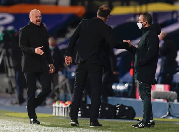 Slaven Bilic, Manager of West Bromwich Albion and Sean Dyche, Manager of Burnley interact with the Fourth Official Kevin Friend at full-time after the Premier League match between West Bromwich Albion and Burnley at The Hawthorns on October 19, 2020 in West Bromwich, England.