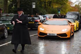 Super cars led the procession to the church