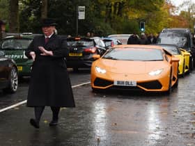 Super cars led the procession to the church