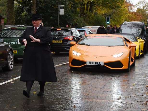 Super cars led the procession to the church