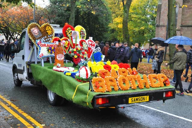 Many floral tributes were carried to the church on trailers